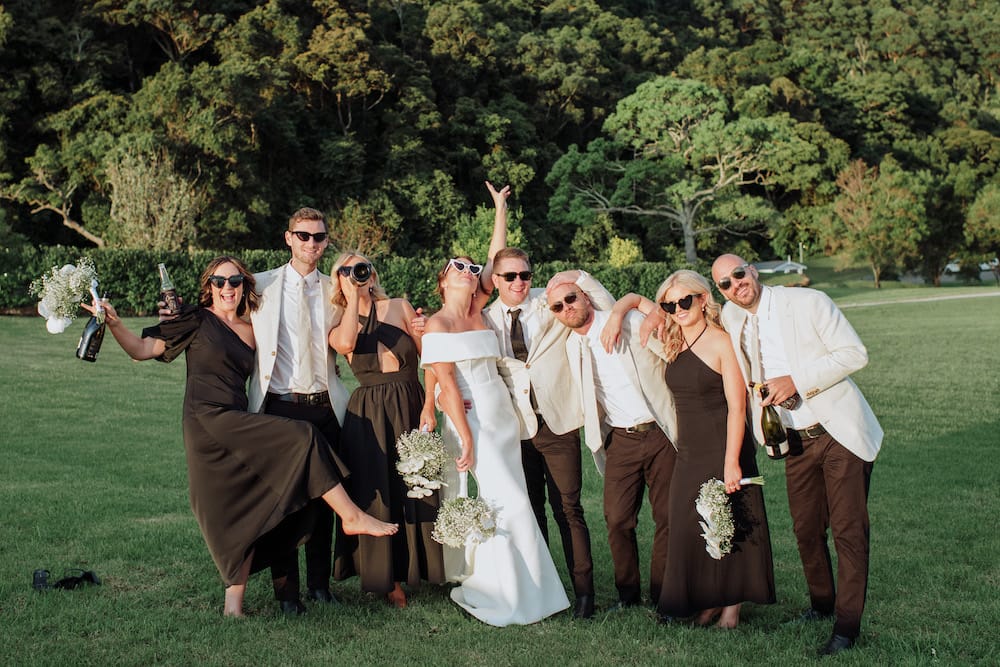 Bridal party having fun at their photo shoot after the wedding ceremony